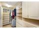 Organized walk-in closet with custom shelving, drawers, and ample storage space at 2604 Porchside Se Pl, Atlanta, GA 30316