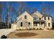 Beautifully landscaped two-story home with a stone and siding exterior and an attached two-car garage at 4040 Sierra Vista Cir, Cumming, GA 30040