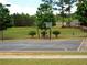 Outdoor basketball court in a Gathering friendly neighborhood with trees and grass at 43 Wickford Way, Villa Rica, GA 30180