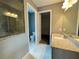 Bathroom showcasing granite countertops, tile floor, a glass enclosed shower, and walk-in closet at 43 Wickford Way, Villa Rica, GA 30180