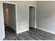 Bedroom with two doorways and luxury vinyl plank flooring at 43 Wickford Way, Villa Rica, GA 30180