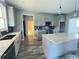 Modern kitchen featuring grey cabinets, large island with white countertop, and stainless steel appliances at 43 Wickford Way, Villa Rica, GA 30180