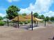Park pavilion area with picnic tables and sunshades next to playground under bright blue skies at 43 Wickford Way, Villa Rica, GA 30180