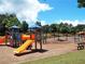 Colorful playground with slides, climbing structures, and swings, designed for fun and activity at 43 Wickford Way, Villa Rica, GA 30180
