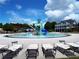 Community pool with a water park feature and lounge chairs, ideal for Gathering fun and relaxation at 43 Wickford Way, Villa Rica, GA 30180