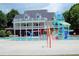 Community pool with fun water features and a two-story clubhouse perfect for a relaxing day at 43 Wickford Way, Villa Rica, GA 30180
