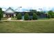 Tennis courts with manicured landscaping and a covered shelter, perfect for outdoor recreation at 43 Wickford Way, Villa Rica, GA 30180