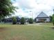 Tennis courts featuring well-maintained landscaping and a covered shelter, ideal for active residents at 43 Wickford Way, Villa Rica, GA 30180