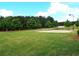 Well-maintained sand volleyball court surrounded by lush greenery, perfect for outdoor recreation at 43 Wickford Way, Villa Rica, GA 30180