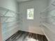 Walk-in closet featuring vinyl floors and steel shelving at 43 Wickford Way, Villa Rica, GA 30180