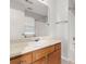 Bathroom features a marble countertop, wood cabinets, and a mirror at 4370 Stone Gate Way # 97, Atlanta, GA 30344