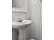 Bathroom showcasing a pedestal sink and white wall mirror at 4370 Stone Gate Way # 97, Atlanta, GA 30344