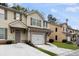 Beautiful townhouse with stone accents, a garage, and well-maintained landscaping at 4370 Stone Gate Way # 97, Atlanta, GA 30344