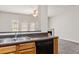 Open kitchen view from living area with stainless steel sink and dishwasher at 4370 Stone Gate Way # 97, Atlanta, GA 30344