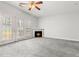 Bright living room featuring a fireplace, ceiling fan, and french doors to the outside at 4370 Stone Gate Way # 97, Atlanta, GA 30344
