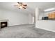 Open-concept living area with a fireplace, neutral walls, and a ceiling fan at 4370 Stone Gate Way # 97, Atlanta, GA 30344