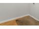 Image of room with wood flooring and a carpet rug on top at 4370 Stone Gate Way # 97, Atlanta, GA 30344