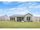 Green backyard features screened porch, level ground, and partial fence at 448 Marston Pass, Acworth, GA 30102