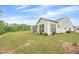 Green backyard shows screened porch, level ground, and ample sunlight at 448 Marston Pass, Acworth, GA 30102