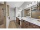 Bathroom with double vanity, tile floors, large mirrors, walk in shower and neutral paint at 448 Marston Pass, Acworth, GA 30102