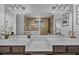 Bathroom with double vanity, tile floors, large mirrors, walk in shower and neutral paint at 448 Marston Pass, Acworth, GA 30102