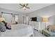 Bedroom with white furniture, neutral walls and carpets, barn door, and ceiling fan at 448 Marston Pass, Acworth, GA 30102