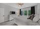 Bedroom with white furniture, neutral walls and carpets, large windows and ceiling fan at 448 Marston Pass, Acworth, GA 30102