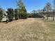 Grassy community area featuring a pet waste station, bench, and mature trees for walking at 448 Marston Pass, Acworth, GA 30102