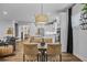 Open-concept dining area with seamless flow to the kitchen and living spaces at 448 Marston Pass, Acworth, GA 30102