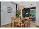 Bright dining room with wood floors and a modern chandelier at 448 Marston Pass, Acworth, GA 30102