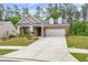 Charming single-Gathering home features a brick facade, two-car garage, and well-manicured front lawn at 448 Marston Pass, Acworth, GA 30102