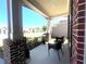 Welcoming front porch featuring brick columns, comfortable seating, and a neighborhood view at 448 Marston Pass, Acworth, GA 30102