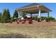 Community gazebo with a seating area, surrounded by landscaped plantings and mature trees at 448 Marston Pass, Acworth, GA 30102