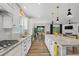 Open-concept kitchen with a large island, granite countertops, stainless appliances, and ample cabinet space at 448 Marston Pass, Acworth, GA 30102