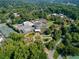 Stunning aerial view of a botanical garden featuring lush greenery, walking paths, and unique architectural structures at 1058 Piedmont Ave # 103, Atlanta, GA 30309