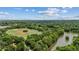 Aerial view of a park featuring a baseball field, lake, and lush greenery, showcasing recreational amenities and natural beauty at 1058 Piedmont Ave # 103, Atlanta, GA 30309