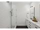 Modern bathroom featuring white subway tile, glass shower, and a vanity with marble countertop at 1058 Piedmont Ave # 103, Atlanta, GA 30309