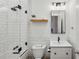 Stylish bathroom featuring subway tile, a bathtub, a modern vanity, and glass shower door at 1058 Piedmont Ave # 103, Atlanta, GA 30309