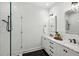 Elegant bathroom with a glass shower, white subway tile, and double sink vanity with marble countertops at 1058 Piedmont Ave # 103, Atlanta, GA 30309