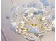 Unique floral-design chandelier with leaf-like petals and gold accents illuminates the room at 1058 Piedmont Ave # 103, Atlanta, GA 30309