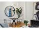 Modern dining area features pendant lighting, a round table with seating, and plant decoration at 1058 Piedmont Ave # 103, Atlanta, GA 30309
