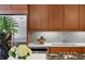 Modern kitchen featuring stainless steel appliances, modern wood cabinets, and stylish backsplash at 1058 Piedmont Ave # 103, Atlanta, GA 30309