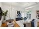Bright living room featuring hardwood floors, modern lighting, stylish furniture, and abstract art at 1058 Piedmont Ave # 103, Atlanta, GA 30309