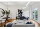 Bright living room features modern lighting, hardwood floors, stylish furniture, and large abstract art at 1058 Piedmont Ave # 103, Atlanta, GA 30309