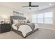 The spacious bedroom features neutral colors, carpet, and a large window at 1895 Deco Dr, Kennesaw, GA 30144
