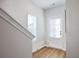 Hallway features hardwood floors and a door with natural light at 1895 Deco Dr, Kennesaw, GA 30144