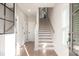 Bright entryway featuring hardwood floors, staircase, and natural light at 1895 Deco Dr, Kennesaw, GA 30144