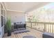 Enjoy the outdoors on this covered porch with ample seating, a beautiful view and a ceiling at 1895 Deco Dr, Kennesaw, GA 30144