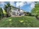 Lovely backyard with mature trees, a plush lawn, and a cozy patio for entertaining at 338 Santa Anita Ave, Woodstock, GA 30189