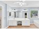 Bright bathroom featuring double sinks, and ample counter space for modern convenience at 338 Santa Anita Ave, Woodstock, GA 30189